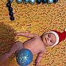 baby, infant, santa_hat, christmas_ornaments, blue_balls, black_balls, holiday, festive, candy_cane_pattern, background, lying_down, naked, cute, holiday_decor, celebration, christmas, toy, festive_background, child, holiday_spirit