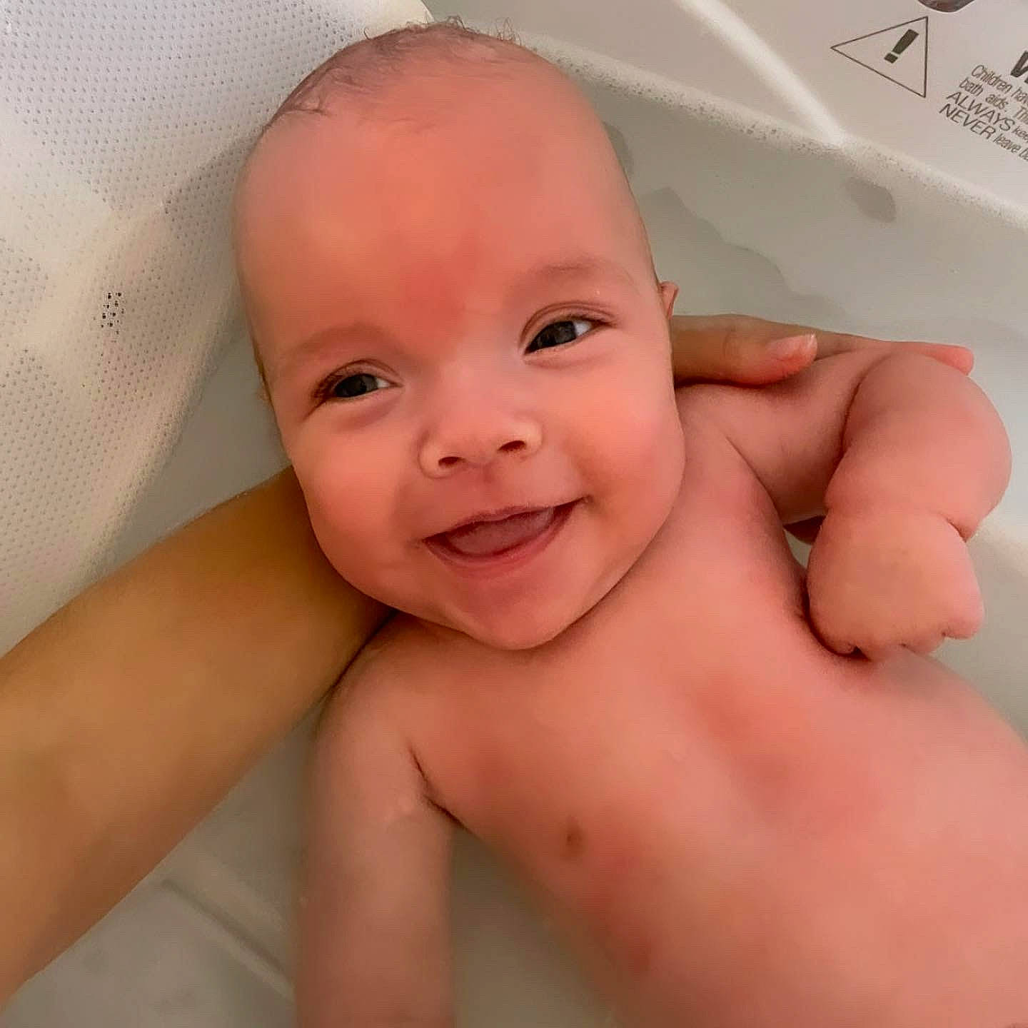 Shayde is registered to the contest to win money with this photo: baby_bathing, bathtub, cheek, ear, eye, eyebrow, eyelash, face, hair, happy, head, human_body, jaw, joy, lip, mouth, neck, nose, person, skin