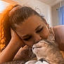Opal is registered to the contest to win money with this photo: woman, cat, indoor, affection, pet, closeup, head, face, hair, comfort, love, human, animal, casual, relaxation, feline, apparel, shirt, warm_light, intimacy