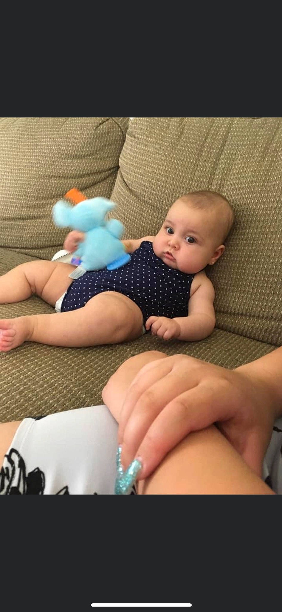 Lilianna is registered to the contest to win money with this photo: aqua, azure, baby, barefoot, child, comfort, finger, foot, hand, joint, knee, lap, leg, nail, person, skin, thigh, thumb, toddler, toy