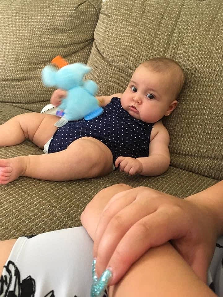 Lilianna is registered to the contest to win money with this photo: aqua, baby, baby_toddler_clothing, body_jewelry, comfort, finger, foot, gesture, hand, human, joint, knee, leg, nail, organ, person, skin, textile, thigh, thumb