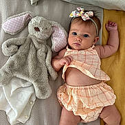 Soleil joined the competition — help win amazing prizes! baby, infant, stuffed_animal, plush_toy, blanket, headband, floral_pattern, peach_clothing, plaid_pattern, cute, child, lying_down, soft_texture, toy, pink, white, yellow, skin, arm, face