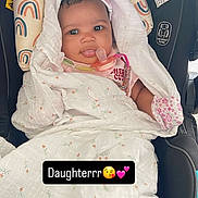 Hermayia joined the competition — help win amazing prizes! baby, child, blanket, car_seat, pacifier, pink_hat, mittens, face, person, infant, cute, wrapped, rainbow_pattern, headrest, clothing, indoors, portrait, young_child, love, text_overlay