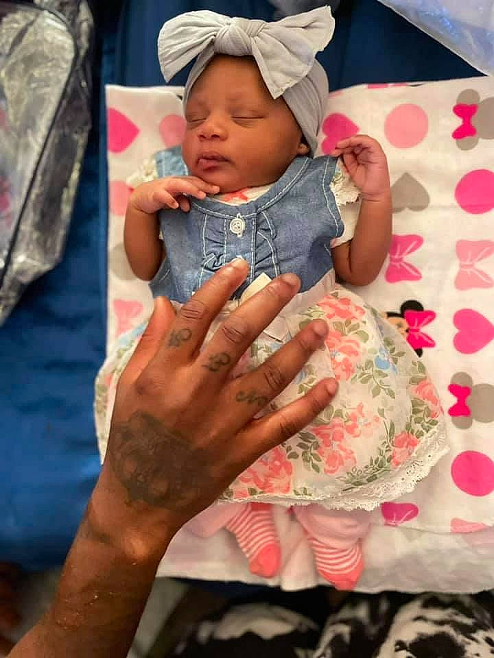 Ramiyah is registered to the contest to win money with this photo: baby, baby_toddler_clothing, baseball_cap, cap, child, comfort, facial_expression, finger, fun, gesture, hand, happy, headwear, nail, pattern, person, pink, product, skin, sleeve