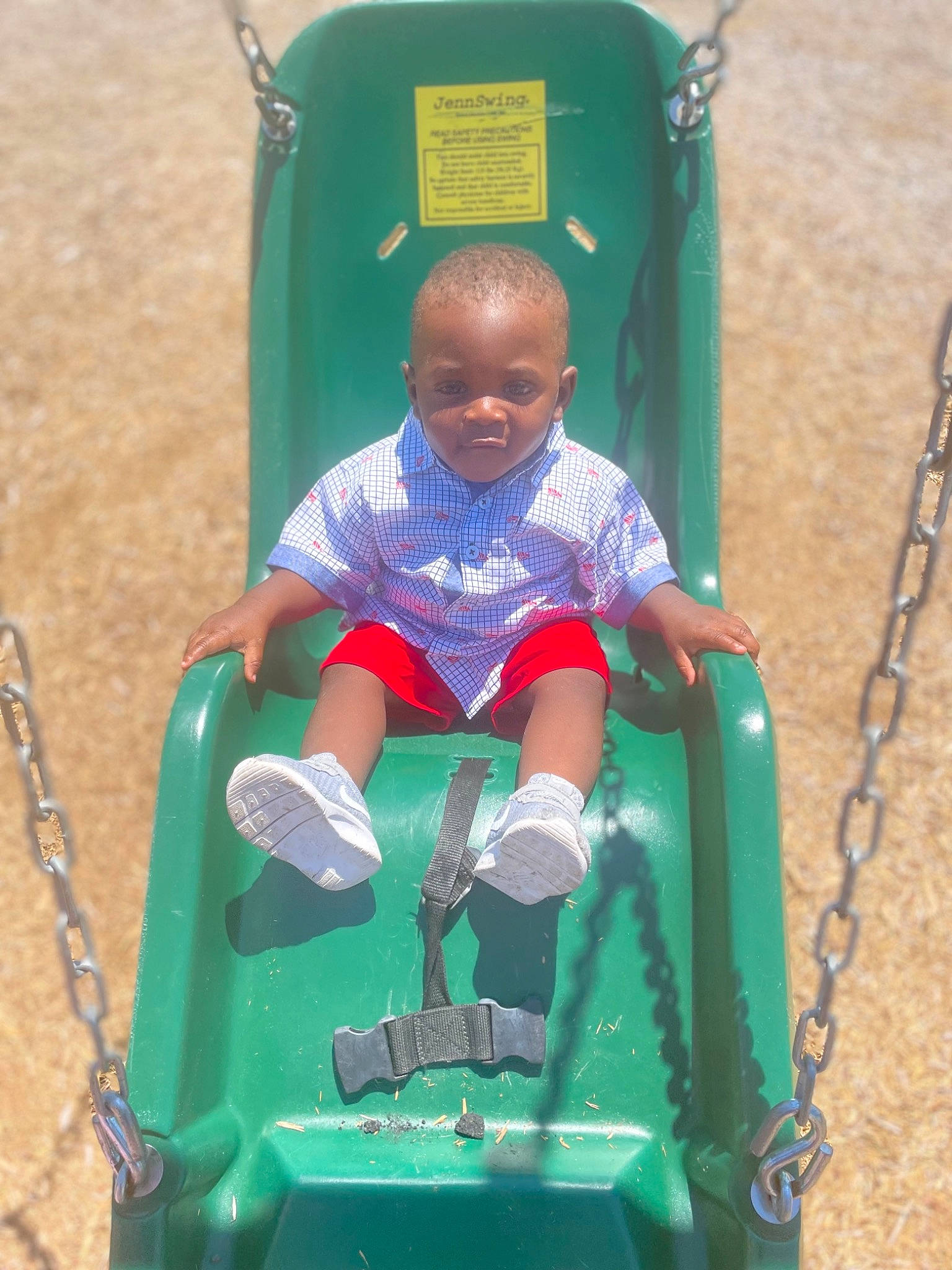 Roddre is registered to the contest to win money with this photo: baby, baby_toddler_clothing, child, chute, city, electric_blue, fun, grass, green, leisure, outdoor_play_equipment, person, plastic, play, playground, playground_slide, recreation, riding_toy, sitting, toddler