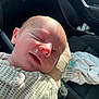 Carter joined the competition — help win amazing prizes! newborn, baby, infant, sleeping, hand, skin, onesie, pattern, face, closed_eyes, car_interior, seat, blanket, light, shadow, closeup, portrait, peaceful, soft, child