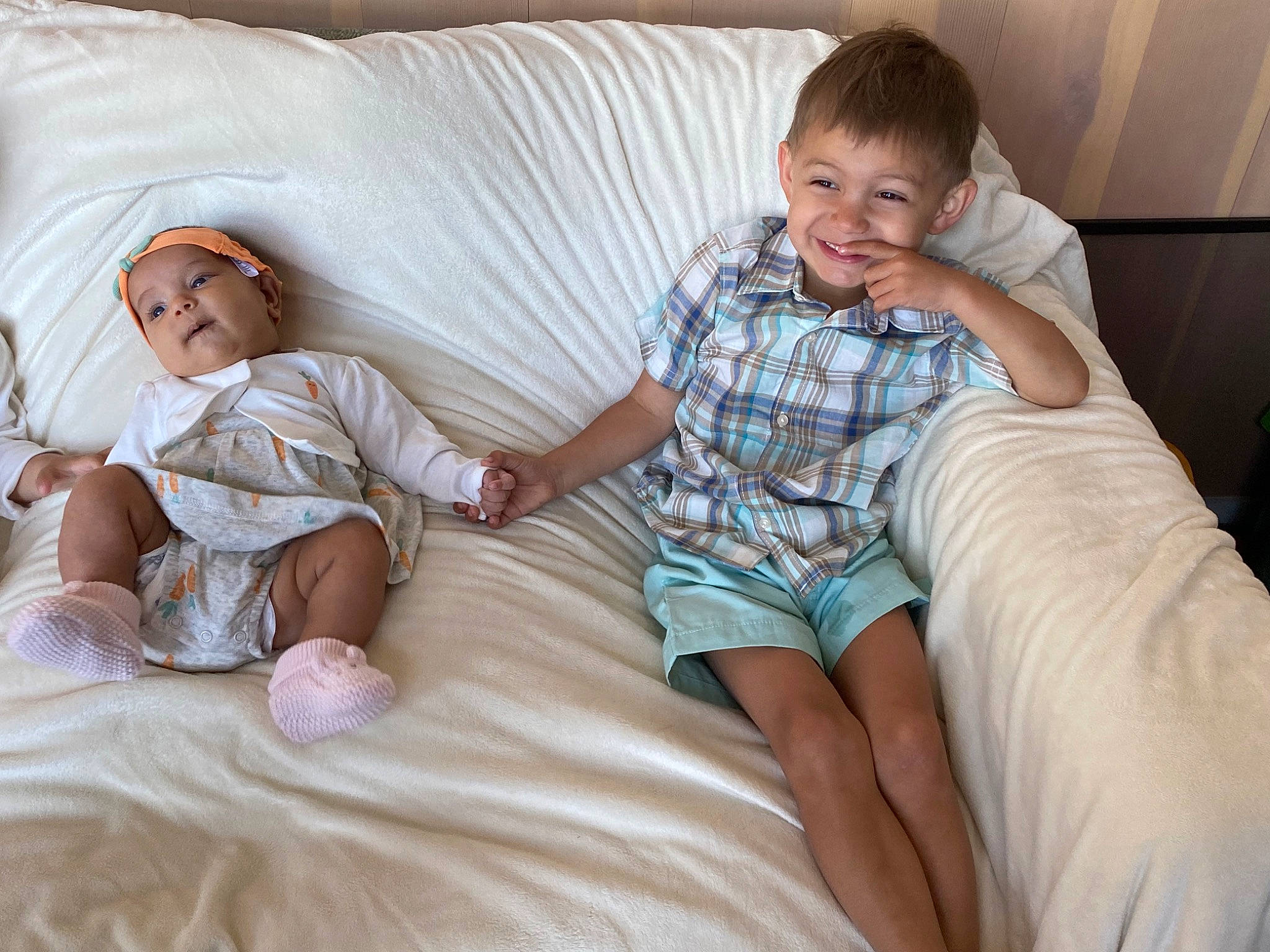 Josephina is registered to the contest to win money with this photo: bedding, blond, comfort, couch, finger, fun, happy, headwear, joy, lap, leg, leisure, linens, person, shorts, sitting, skin, smile, t_shirt, textile