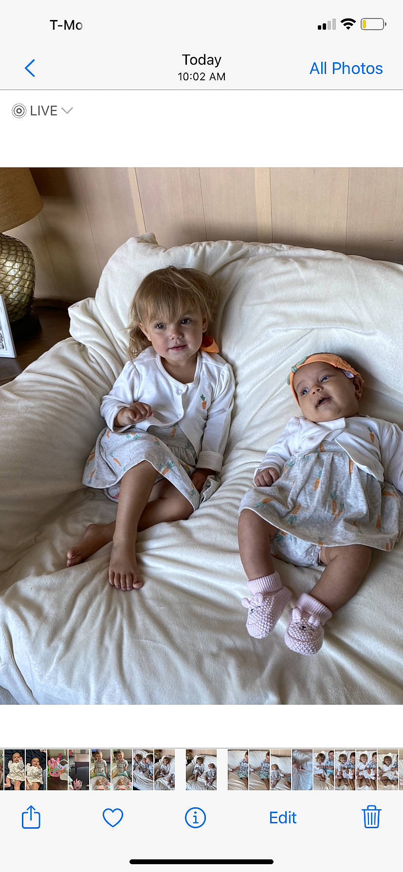 Amelia is registered to the contest to win money with this photo: baby, baby_toddler_clothing, bed_sheet, bedding, child, comfort, fun, gesture, happy, headwear, linens, people, person, pillow, product, shorts, sitting, sleeve, snapshot, t_shirt