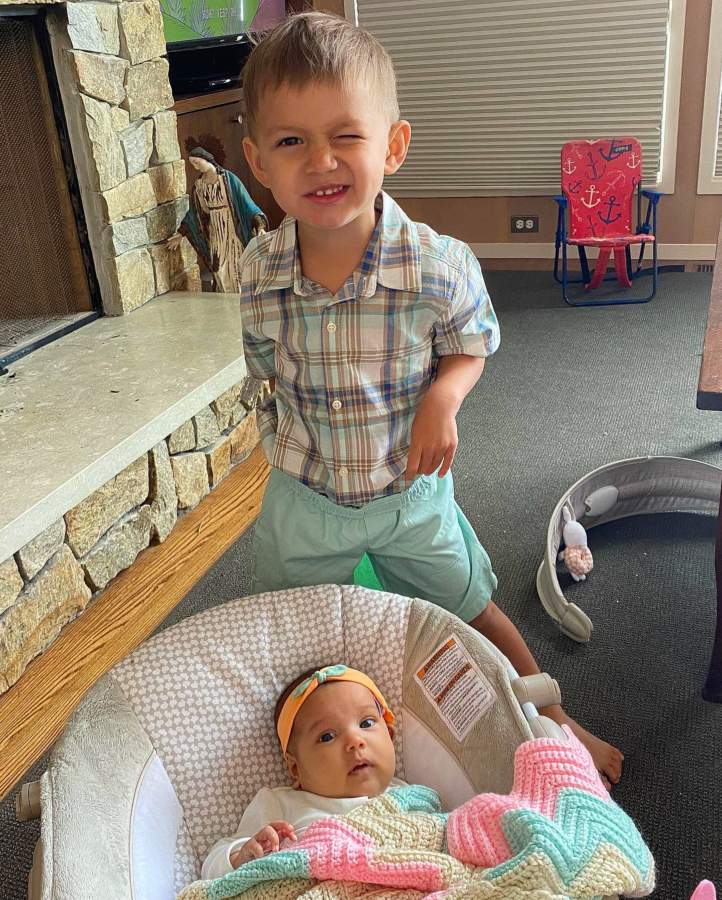 Isiah is registered to the contest to win money with this photo: baby, baby_products, baby_toddler_clothing, chair, child, comfort, eye, face, fun, happy, head, headwear, joy, lap, leisure, person, play, product, shorts, sitting