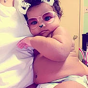 Lotus is registered to the contest to win money with this photo: arm, black_hair, cheek, child, cool, eyewear, finger, fun, girl, glasses, hand, human_hair_color, joint, leg, muscle, pink, purple, skin, thigh, vision_care