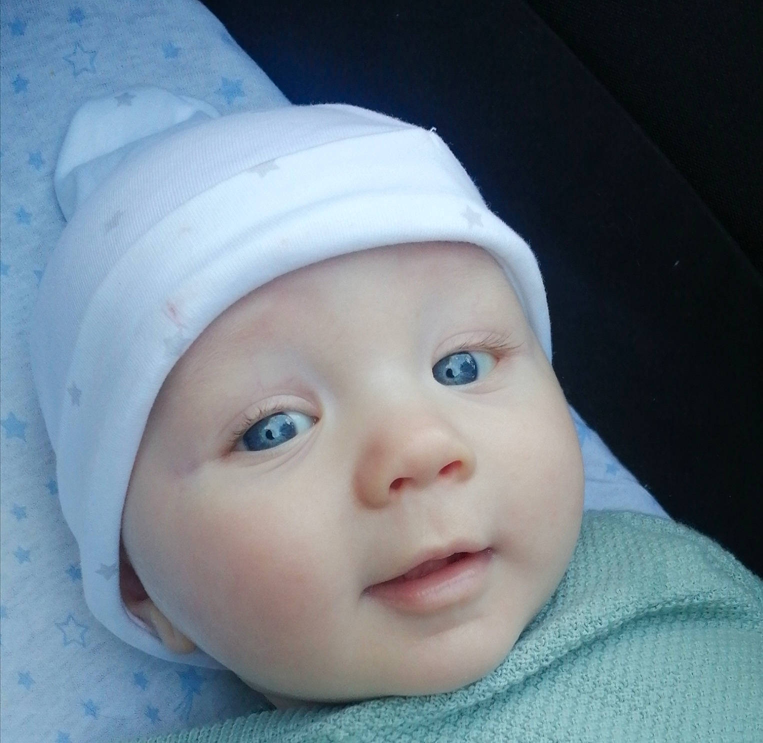 Oslo joined the competition — help win amazing prizes! baby, baby_toddler_clothing, bonnet, cap, cheek, child, electric_blue, eye, eyebrow, eyelash, fashion_accessory, flash_photography, hat, head, headwear, knit_cap, lip, person, portrait_photography, sleeve