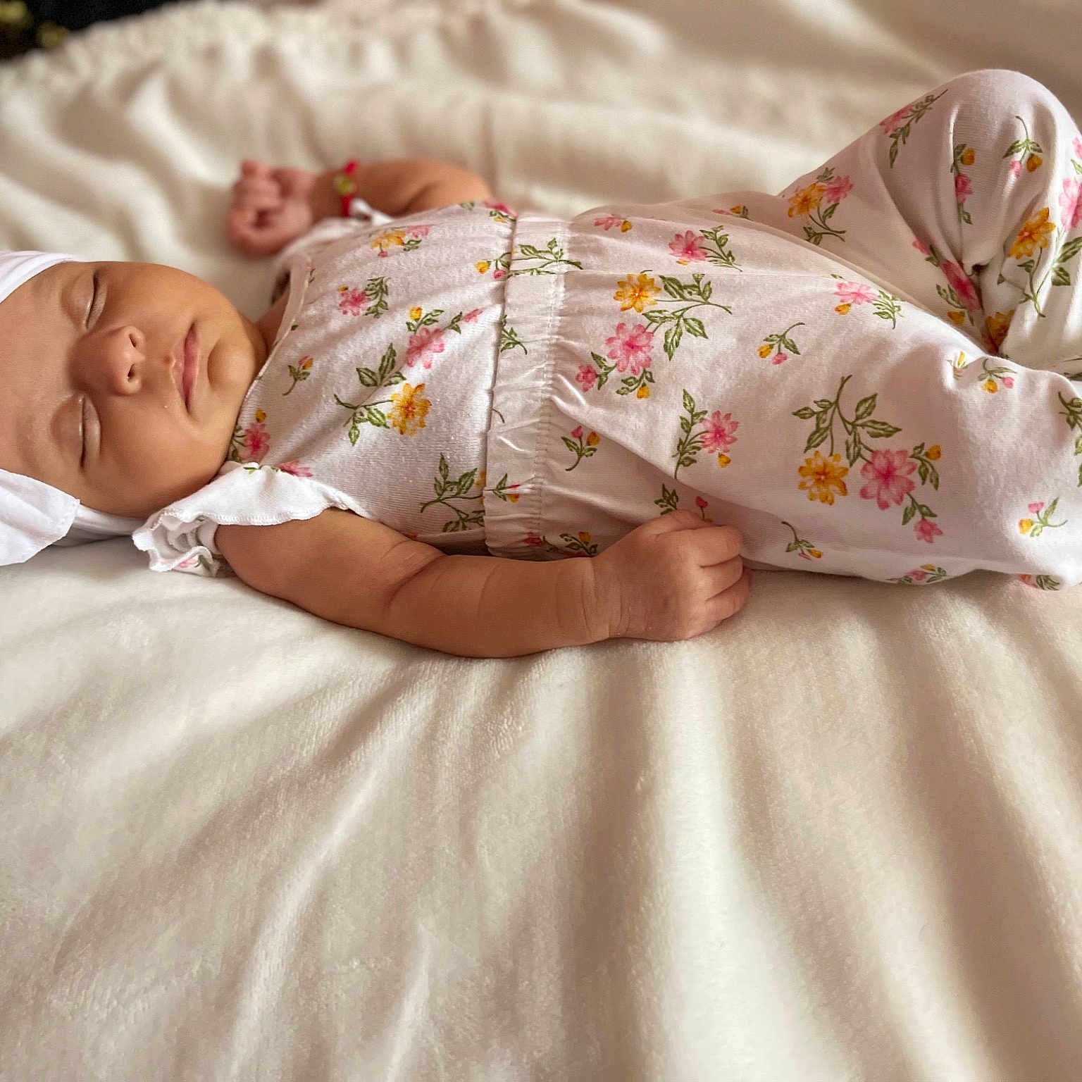 Sonia is registered to the contest to win money with this photo: arm, baby, baby_sleeping, baby_toddler_clothing, bed_sheet, bedding, comfort, couch, dress, finger, flooring, hand, head, human_body, linens, skin, sleeve, textile, thigh, toddler