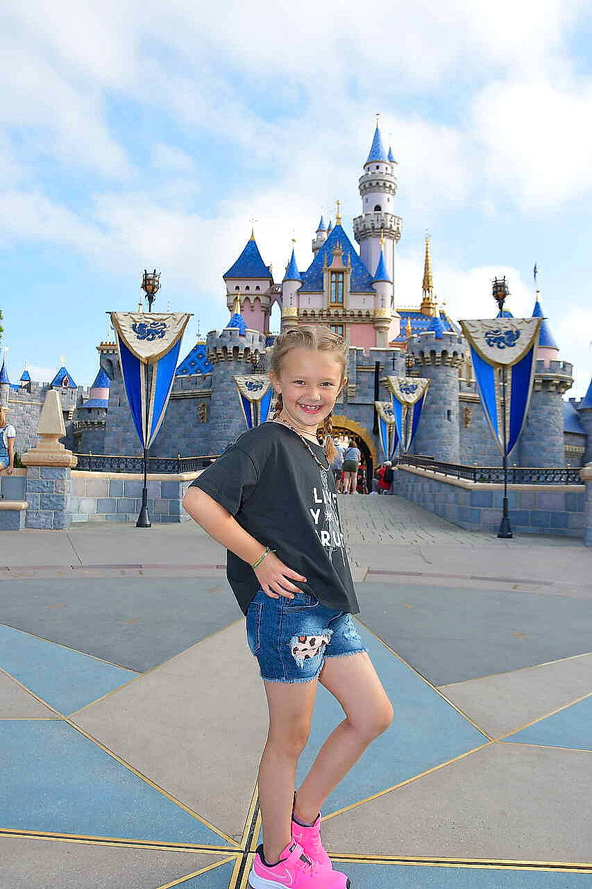 Rosie joined the competition — help win amazing prizes! blue, city, cloud, electric_blue, event, fun, happy, human_leg, joy, leisure, nonbuilding_structure, outdoor_recreation, person, recreation, shorts, sky, smile, summer, toddler, travel