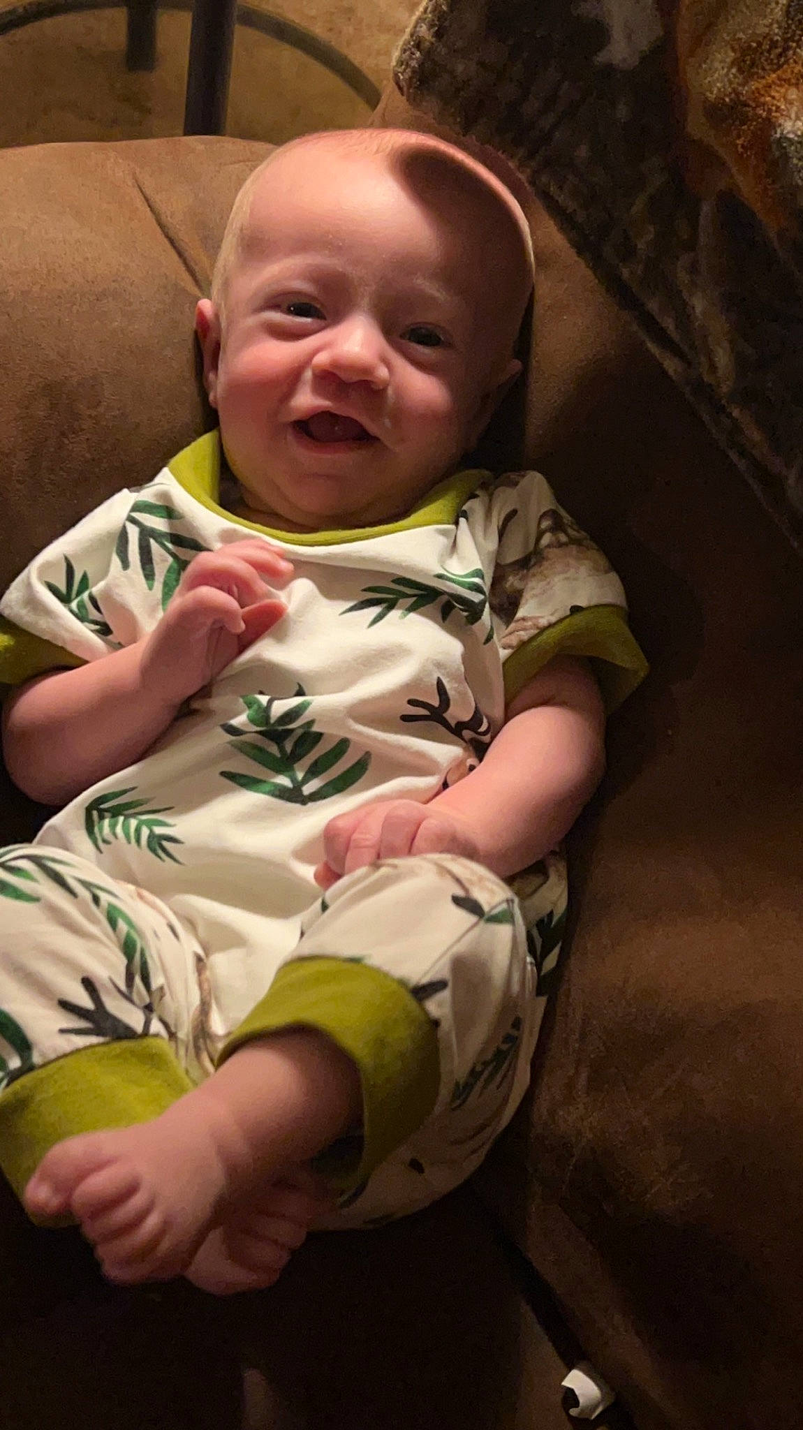 Bradley is registered to the contest to win money with this photo: baby, baby_toddler_clothing, carmine, cheek, child, comfort, elbow, flash_photography, fun, happy, head, human_body, mouth, nose, person, sitting, skin, sleeve, smile, thumb