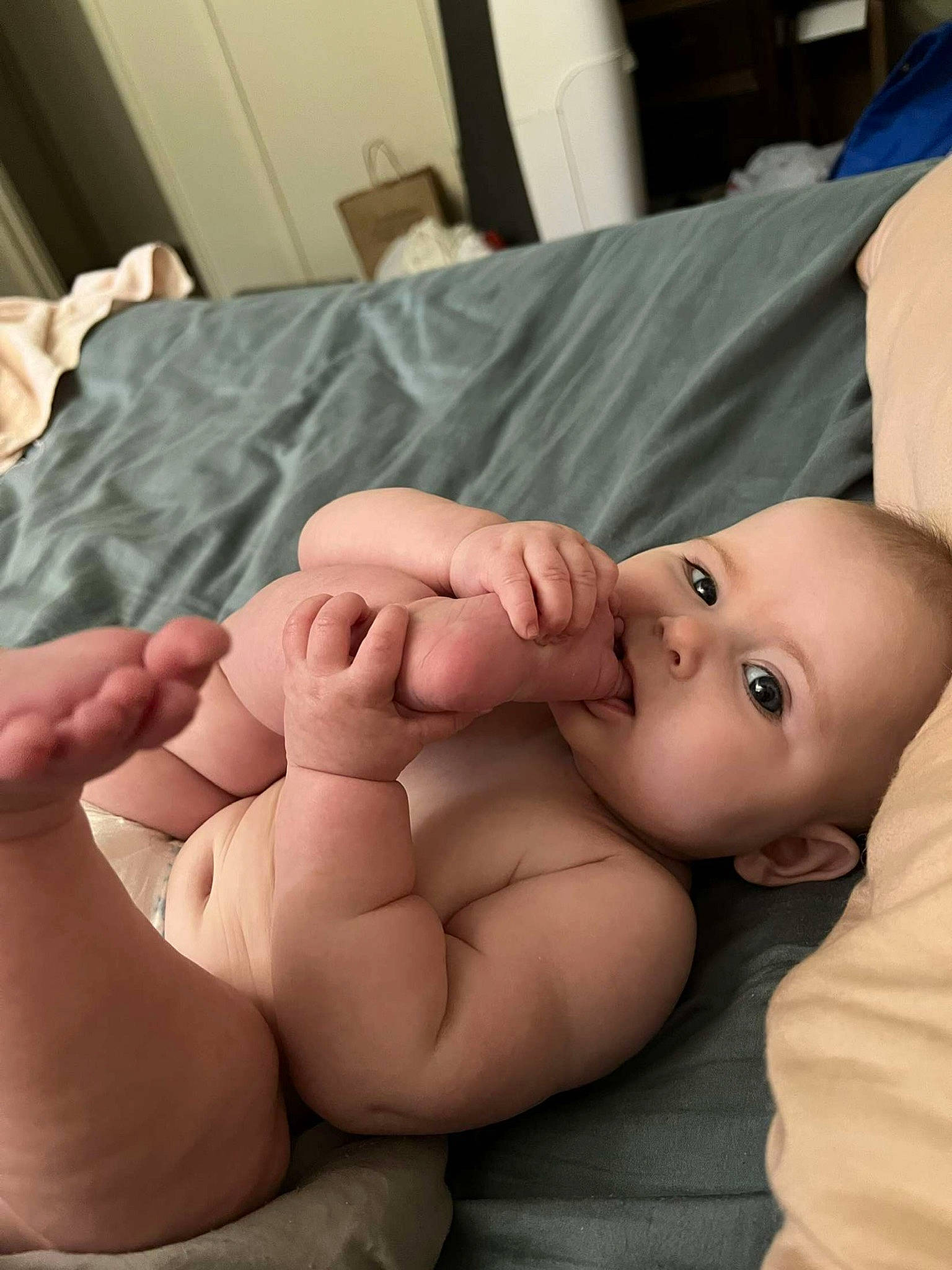 Lyra is registered to the contest to win money with this photo: abdomen, baby, cheek, chest, chin, comfort, eye, eyebrow, eyelash, finger, gesture, head, human_body, lip, mouth, neck, nose, person, skin, stomach