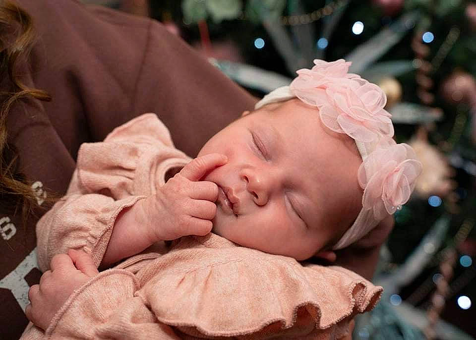 Lila is registered to the contest to win money with this photo: baby, baby_toddler_clothing, cheek, child, comfort, ear, event, eyelash, face, finger, gesture, happy, headwear, human_body, lip, mouth, nail, nose, person, skin