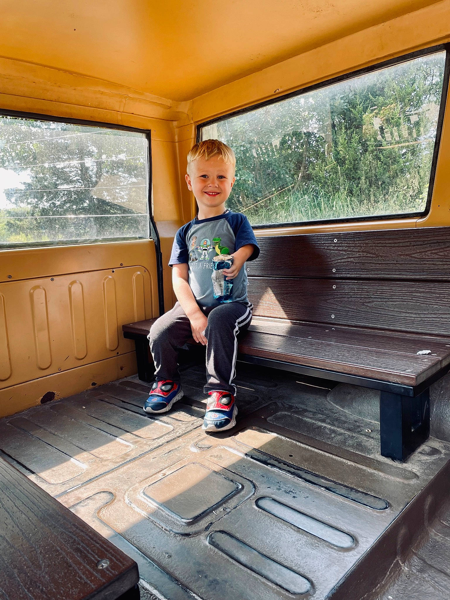 Hank is registered to the contest to win money with this photo: automotive_design, automotive_exterior, floor, flooring, fun, hardwood, home, joy, leisure, luxury_vehicle, mode_of_transport, motor_vehicle, person, recreation, shade, t_shirt, toddler, tree, vehicle, vehicle_door