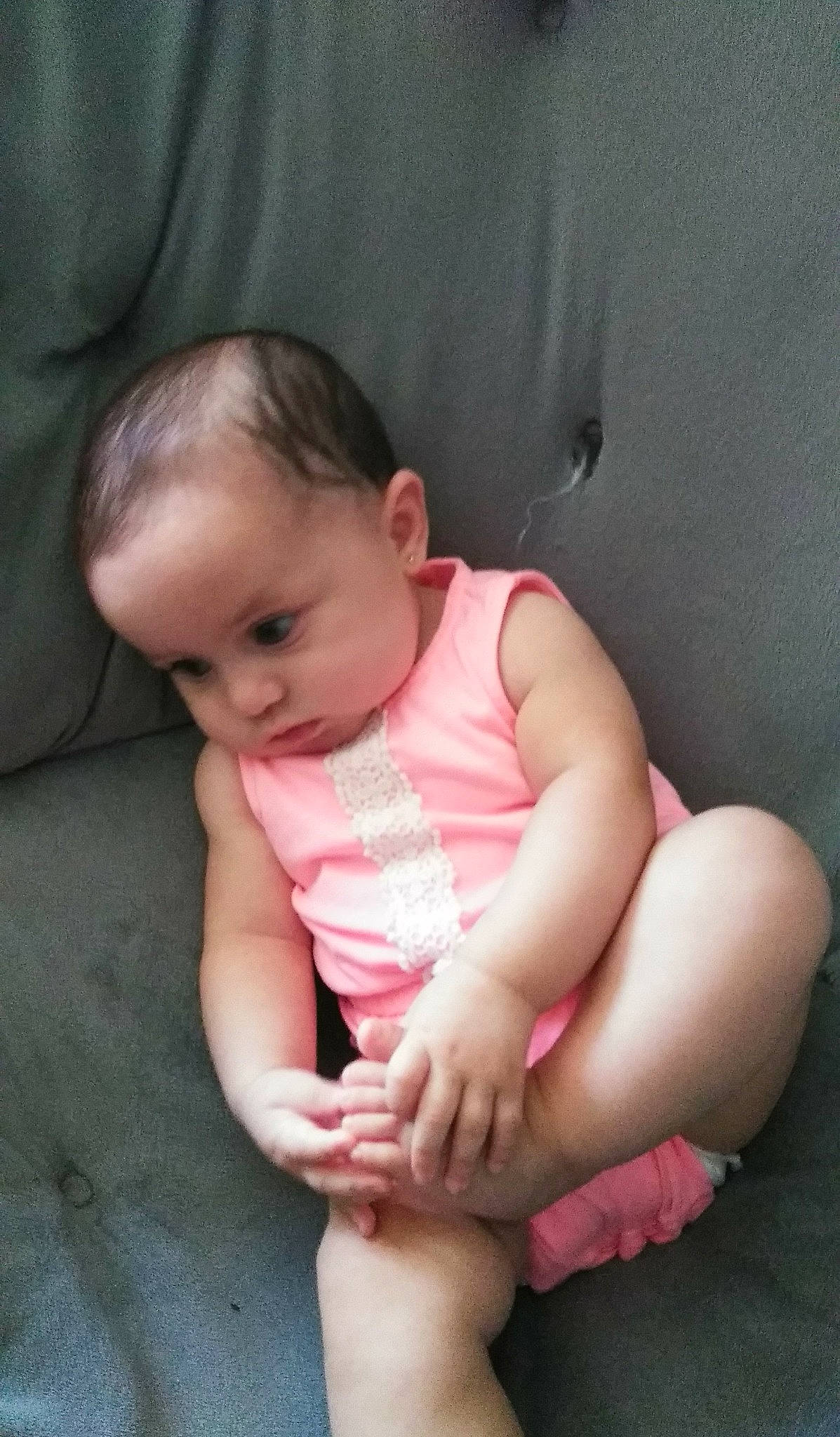 Mila-rose is registered to the contest to win money with this photo: arm, baby, cheek, child, finger, hand, leg, mouth, nose, person, pink, sitting, skin, thumb, toddler