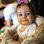 Kinzley joined the competition — help win amazing prizes! baby, child, messy_face, food, bow, purple_bow, highchair, baby_seat, colorful, white_clothing, blue_eyes, person, indoor, blurred_background, cute, infant, portrait, smiling, face, young_child