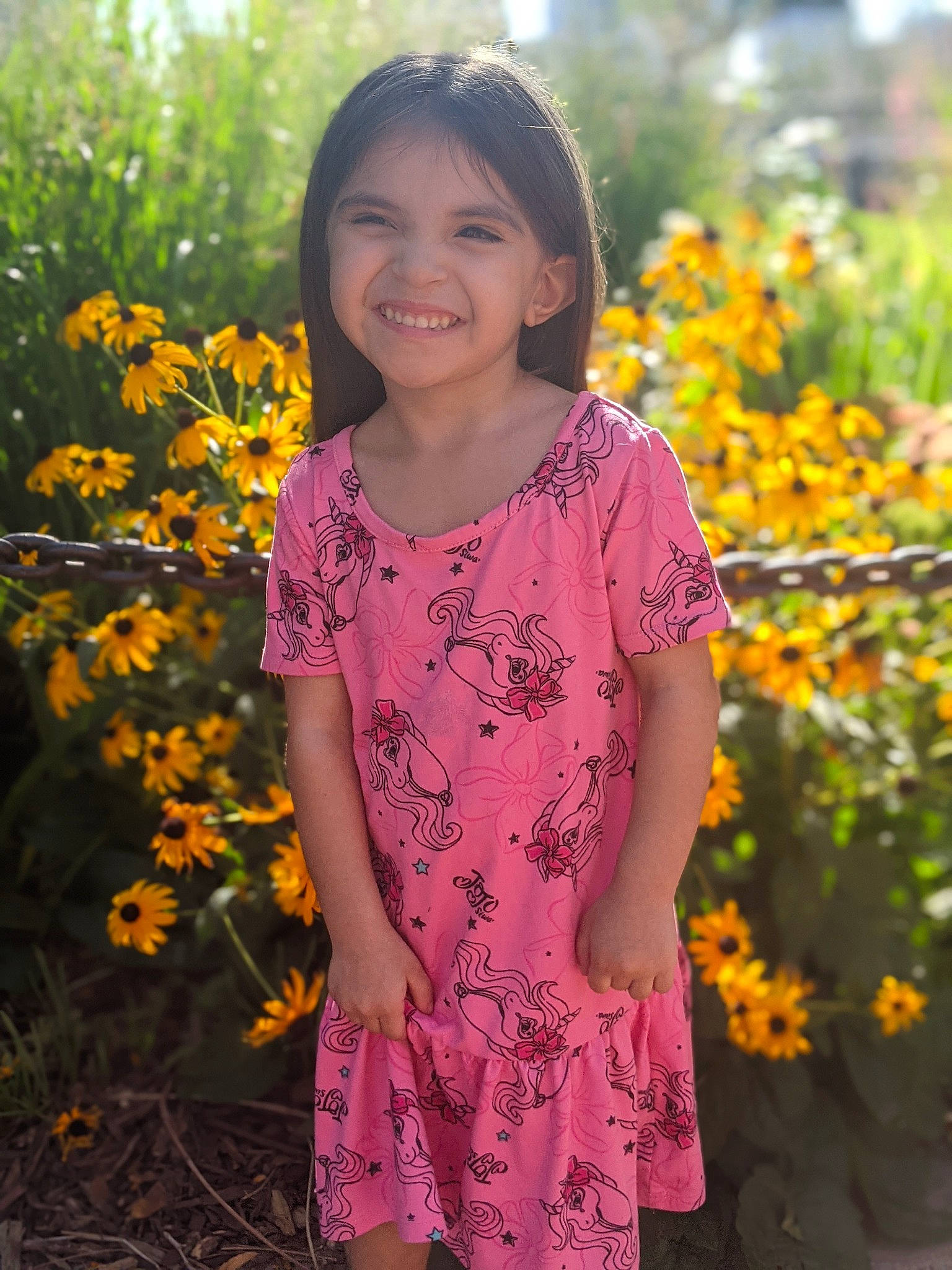 Arianni is registered to the contest to win money with this photo: annual_plant, botany, day_dress, facial_expression, flower, flowering_plant, grass, hair, happy, head, joy, orange, pattern, people_in_nature, person, petal, plant, sleeve, smile, tree