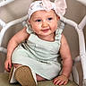 Zelda joined the competition — help win amazing prizes! baby, child, headband, bow, blue_eyes, smile, chair, cushion, clothing, footwear, indoor, person, seated, cute, infant, pastel_colors, portrait, skin, happy, young