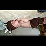 Wesley is registered to the contest to win money with this photo: baby, sleeping, knitted_hat, knitted_pants, brown_clothing, infant, cute, cozy, soft_surface, indoors, child, person, resting, headwear, newborn, nap, adorable, warm, peaceful, toddler