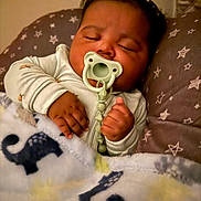 Tyler joined the competition — help win amazing prizes! baby, pacifier, sleeping, blanket, animal_print, cushion, stars, infant, cozy, hands, clothing, bedtime, portrait, cute, indoors, rest, child, soft_texture, comfort, relaxation