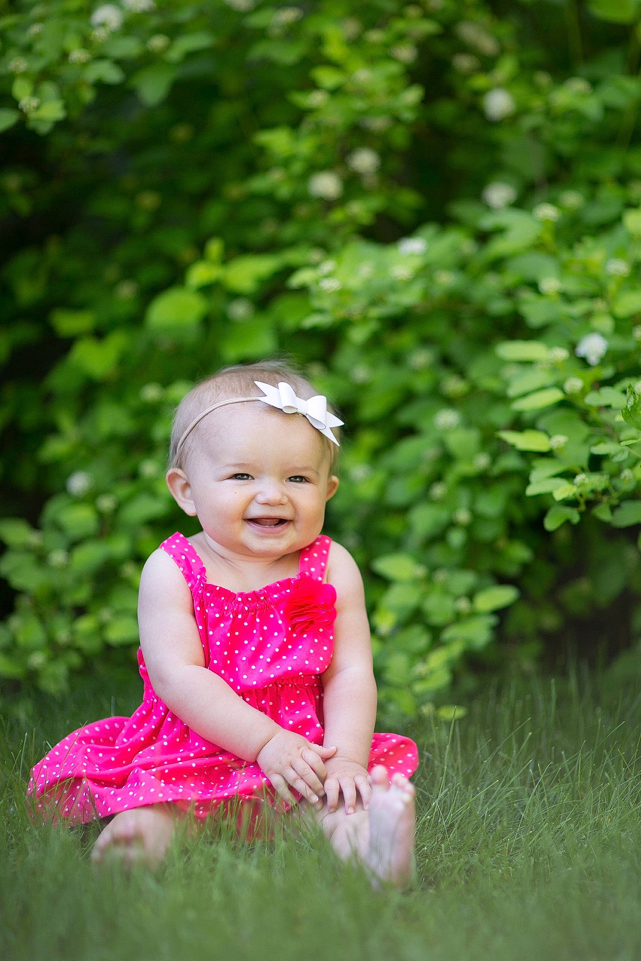 Joyce is registered to the contest to win money with this photo: child, flower, fun, girl, grass, green, happiness, infant, joy, lawn, leaf, person, photograph, photography, pink, plant, portrait_photography, sitting, smile, spring