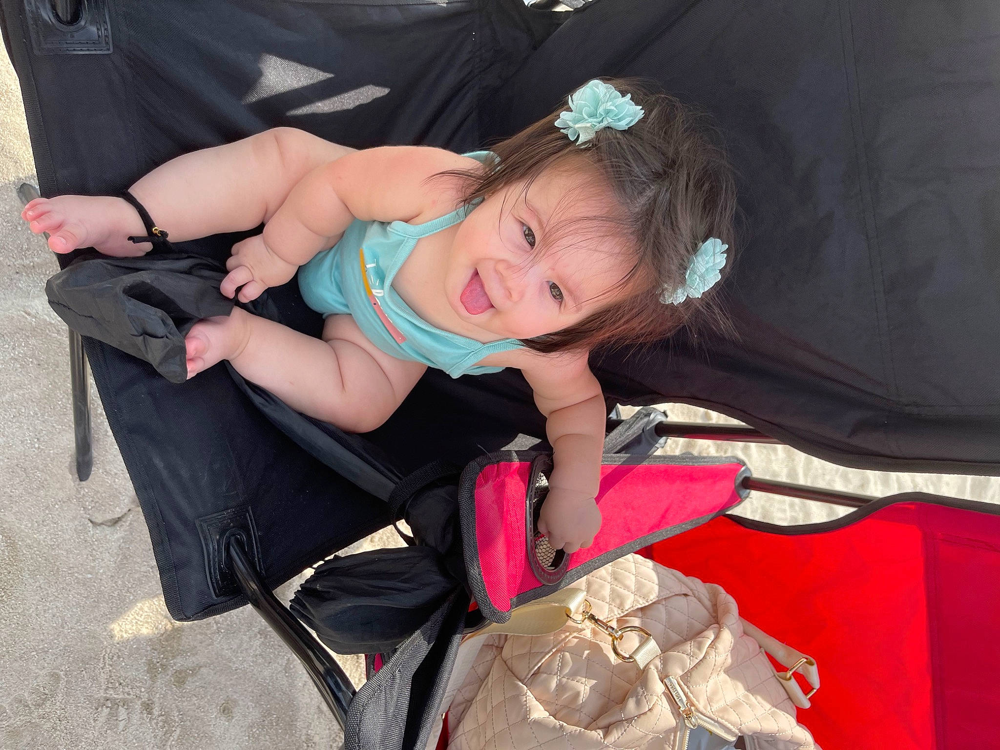 Alaïa joined the competition — help win amazing prizes! baby, baby_products, baby_toddler_clothing, bag, child, dress, event, fashion_accessory, flash_photography, fun, happy, headband, headpiece, jewellery, leg, luggage_and_bags, person, sitting, smile, thigh
