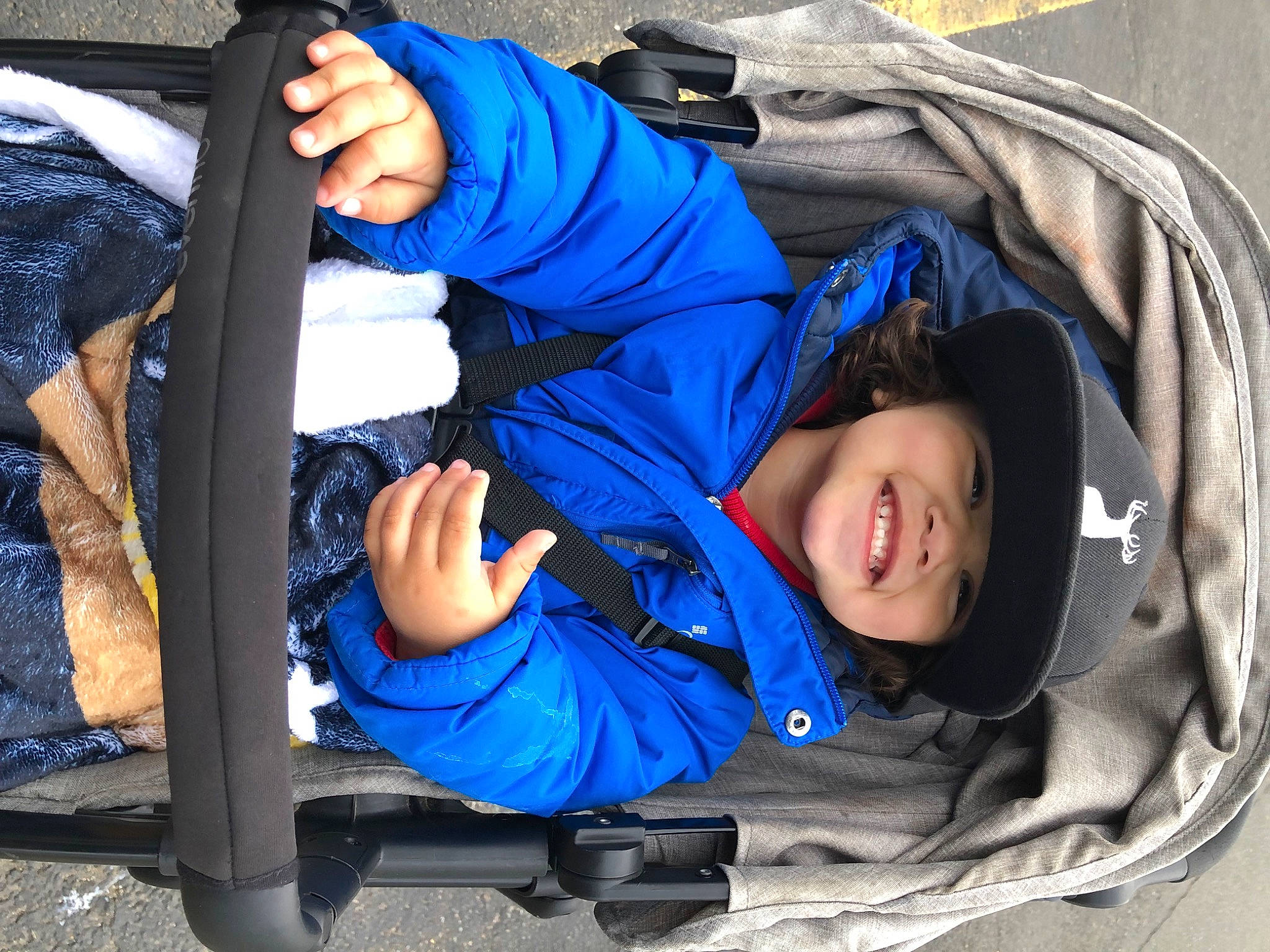 Javier joined the competition — help win amazing prizes! auto_part, baby, baby_carriage, baby_products, baby_toddler_clothing, blue, child, comfort, electric_blue, family_car, fun, headwear, joy, leisure, person, recreation, sitting, smile, toddler, travel
