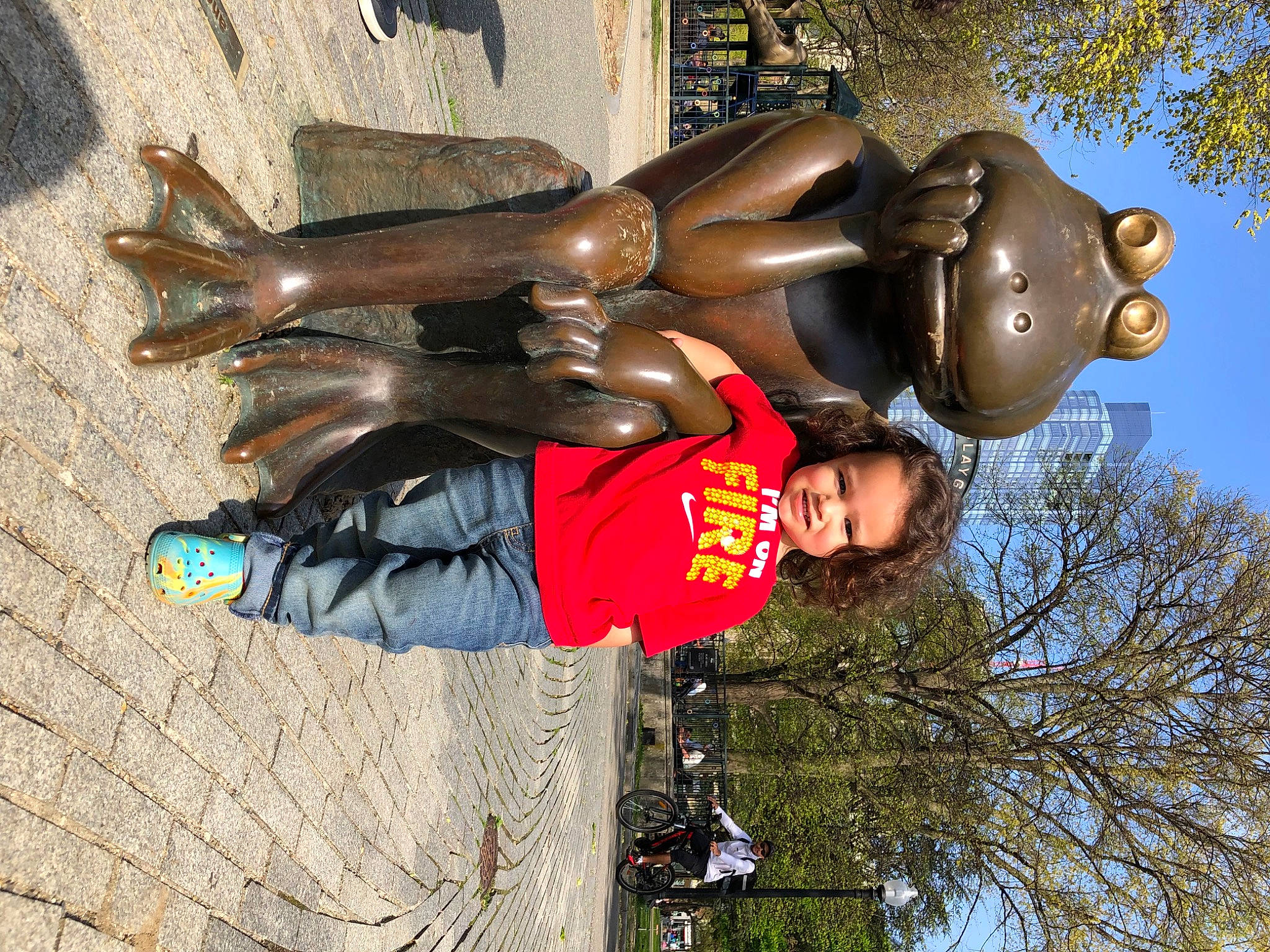 Javier is registered to the contest to win money with this photo: art, carmine, chest, costume, fictional_character, fun, gesture, glove, happy, leisure, person, personal_protective_equipment, sculpture, sky, smile, statue, tree