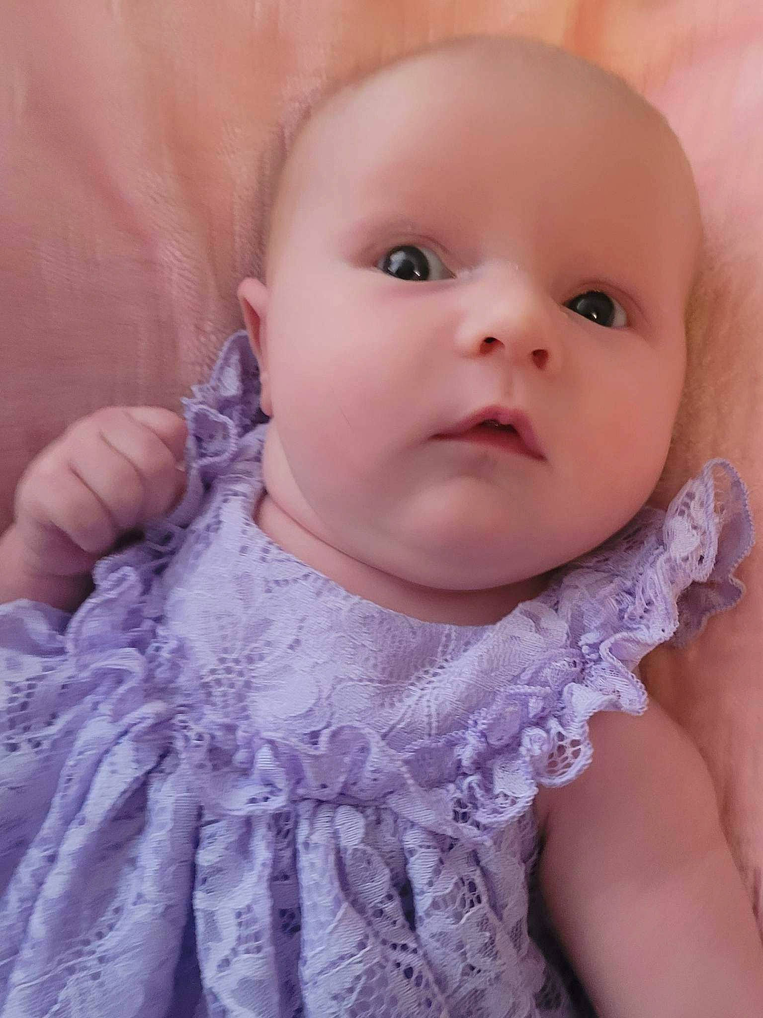 Kaia is registered to the contest to win money with this photo: baby, baby_toddler_clothing, cheek, collar, dress, embellishment, eye, eyebrow, eyelash, finger, gesture, happy, iris, lip, neck, nose, person, pink, skin, sleeve