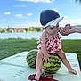 Amilia participe au concours pour gagner de l'argent avec cette photo : baby, child, clothing, cloud, cute, daylight, foot, grass, hand_holding, headband, lake, nature, outdoor, person, picnic_mat, playful, sitting, sky, summer, watermelon