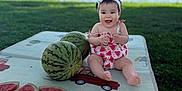 Amilia participe au concours pour gagner de l'argent avec cette photo : baby, child, cute, food, fruit, grass, greenery, happy, headband, lake, nature, outdoor, picnic_mat, playful, sitting, slices, smiling, summer, sunlight, watermelon