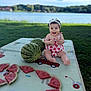 baby, child, cute, food, fruit, grass, greenery, happy, headband, lake, nature, outdoor, picnic_mat, playful, sitting, slices, smiling, summer, sunlight, watermelon