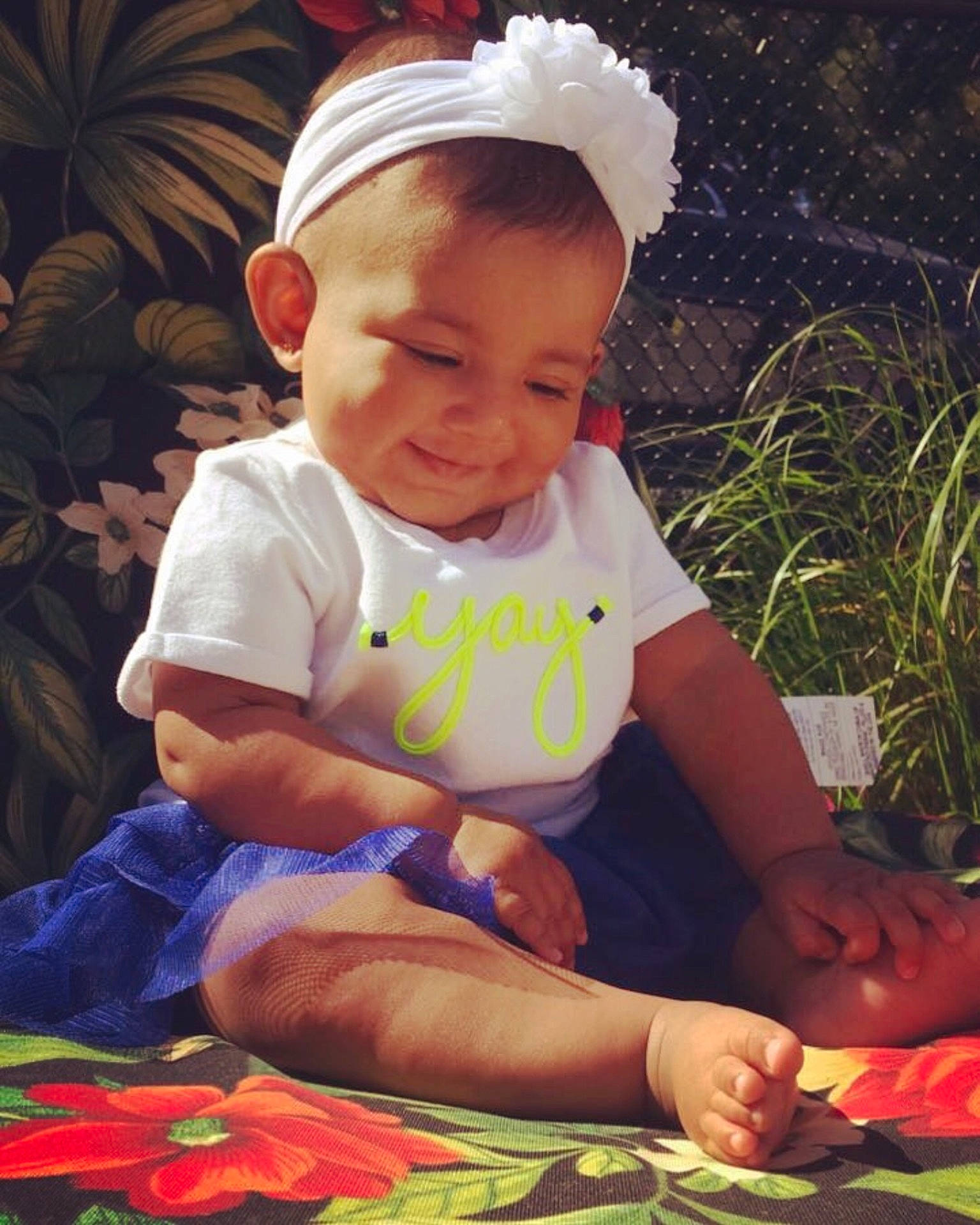 Belle is registered to the contest to win money with this photo: child, fun, girl, hair_accessory, headgear, infant, joy, play, product, smile, toddler