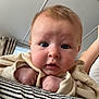 Archie joined the competition — help win amazing prizes! baby, blue_eyes, ceiling, child, close_up, curious, curtains, cushion, cute, face, hands, indoor, infant, person, portrait, resting, soft_lighting, striped, sweater, young