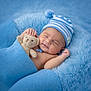 Zaiden joined the competition — help win amazing prizes! baby, sleeping, teddy_bear, blue_blanket, blue_hat, infant, cozy, soft_texture, cute, newborn, child, resting, smile, hand, portrait, bedtime, comfort, warm, peaceful, snuggling