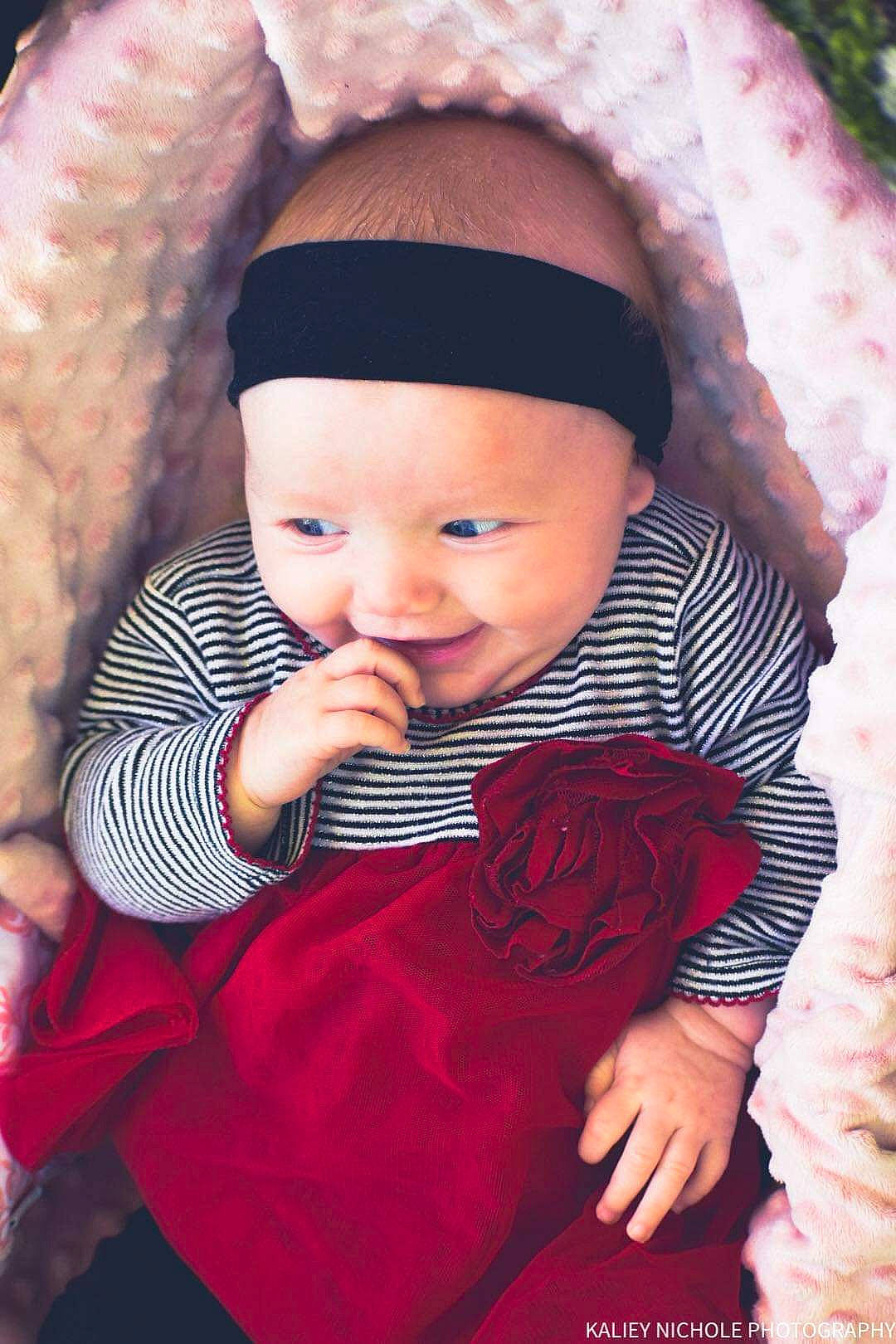 Kaisley is registered to the contest to win money with this photo: baby, baby_toddler_clothing, cap, cheek, chin, dress, facial_expression, flash_photography, happy, headwear, human_body, lip, mouth, outerwear, person, pink, product, purple, skin, sleeve