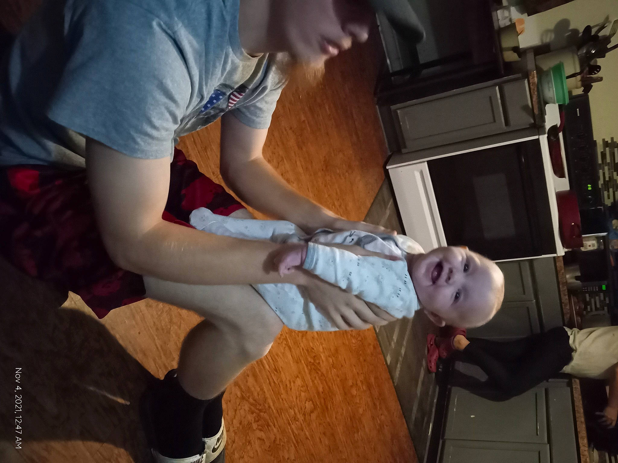 Kaisley is registered to the contest to win money with this photo: baby, child, elbow, eyewear, flooring, fun, gesture, human_leg, joint, joy, knee, lap, person, room, sandal, sitting, t_shirt, thigh, toddler, tree