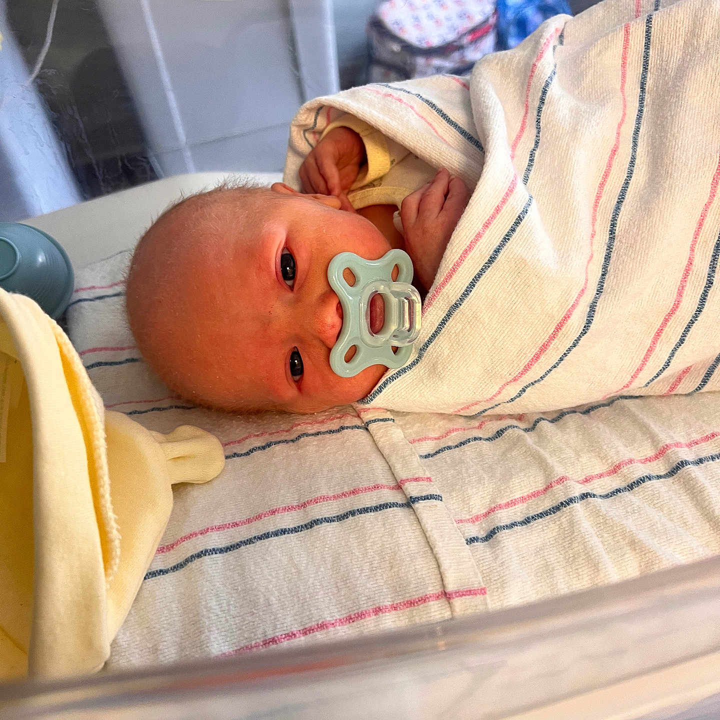 Trevin is registered to the contest to win money with this photo: baby, bassinet, bed, blanket, cute, face, hospital, hospital_room, indoors, infant, lying_down, newborn, pacifier, person, resting, skin, sleeping, small, towel, wrapped
