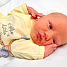 Trevin joined the competition — help win amazing prizes! baby, baby_clothing, cartoon_print, child, close_up, cute, hand_on_face, indoors, infant, lying_down, newborn, peaceful, portrait, pout, resting, sleepy, small_hands, soft_fabric, white_background, yellow_onesie