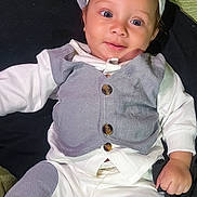 Kobe joined the competition — help win amazing prizes! baby, infant, smiling, face, clothing, cap, vest, white_shirt, pants, patches, hand, eyes, portrait, cute, child, young, relaxed, indoor, person, fashion