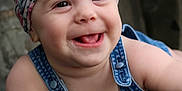 Shifra is registered to the contest to win money with this photo: baby, child, smiling, headband, denim_overalls, happy, face, skin, arm, fingers, outdoor, nature, greenery, portrait, cute, infant, playful, expression, closeup, person