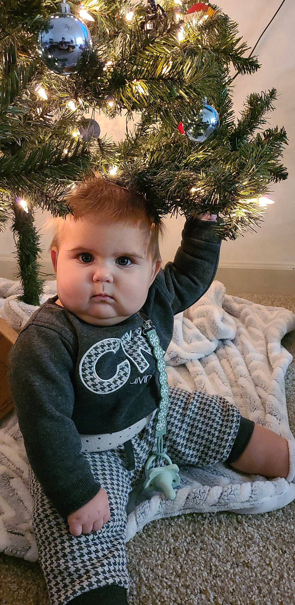 Emilia joined the competition — help win amazing prizes! baby_toddler_clothing, christmas_decoration, christmas_ornament, christmas_tree, event, evergreen, eye, fun, grass, hair, hairstyle, happy, head, holiday_ornament, leaf, ornament, person, plant, shortstraw_pine, toddler