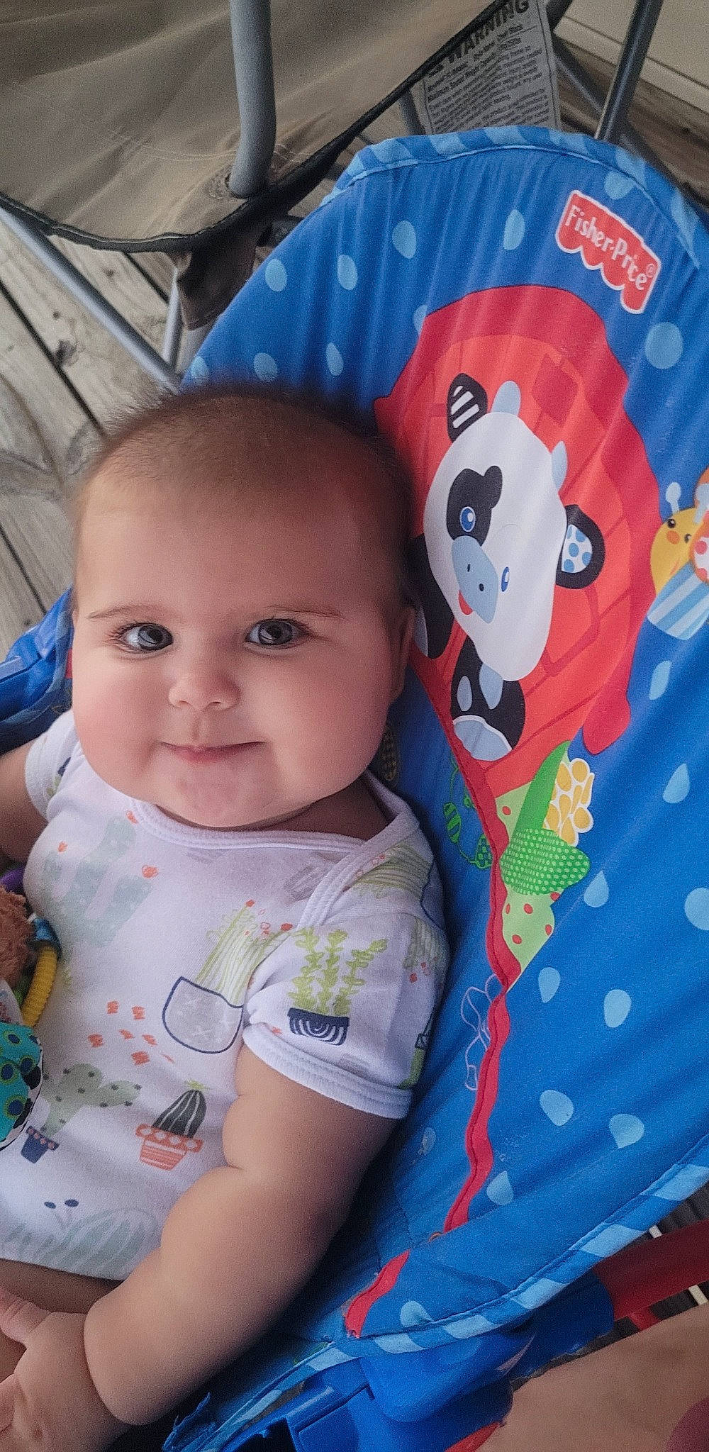 Emilia is registered to the contest to win money with this photo: baby, baby_toddler_clothing, cheek, child, cool, eye, face, facial_expression, fun, hairstyle, happy, head, iris, person, product, skin, sleeve, smile, t_shirt, textile