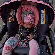 Heaven joined the competition — help win amazing prizes! baby, sleeping, stroller, pink_hat, floral_pajamas, baby_bottle, child, infant, car_seat, baby_seat, baby_clothing, baby_accessories, outdoor, pavement, baby_care, seat_belt, soft_toys, comfort, resting, newborn