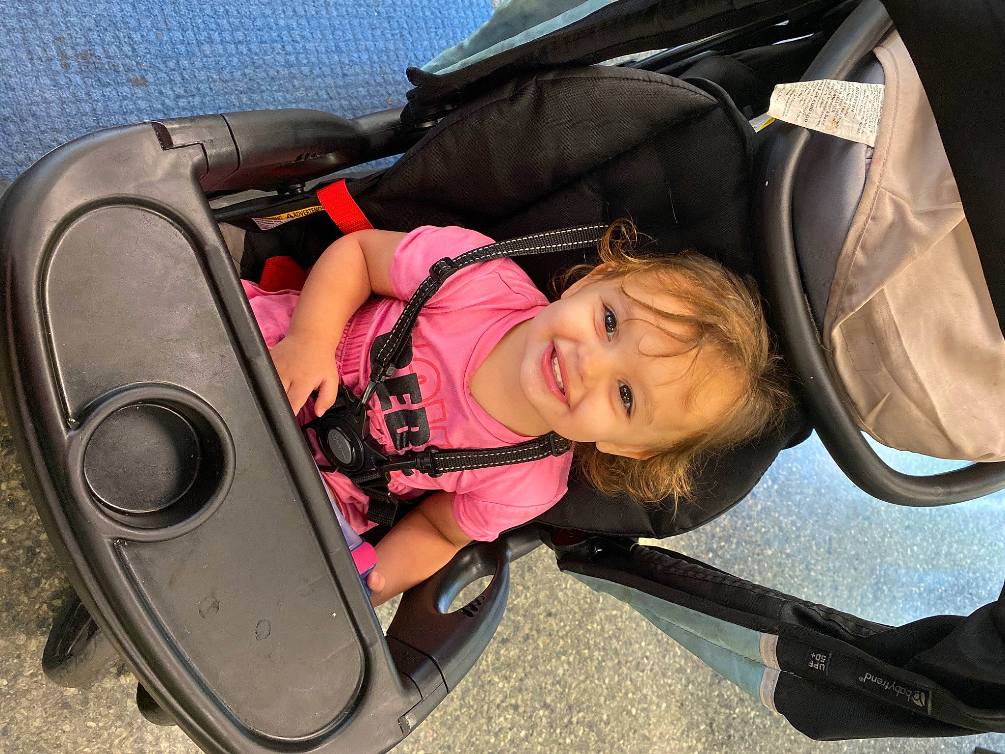 Melissa Mae is registered to the contest to win money with this photo: audio_equipment, auto_part, automotive_design, automotive_exterior, automotive_tire, baby, baby_carriage, baby_products, bumper, car_seat, child, comfort, fun, joy, loudspeaker, motor_vehicle, person, sitting, smile, toddler