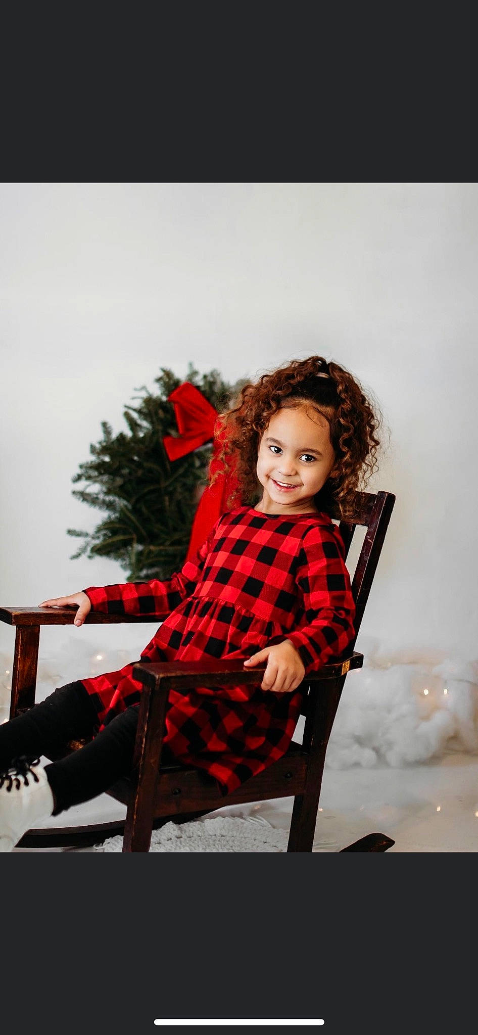 Braelyn is registered to the contest to win money with this photo: brown_hair, chair, fashion_design, flash_photography, fur, furniture, happy, joy, knee, leggings, magenta, pattern, person, plaid, sitting, sleeve, smile, tartan, toddler, tree