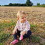 toddler, child, grass, field, outdoor, nature, pink_socks, pink_top, curious, sitting, baby, portrait, daylight, casual_clothing, nature_background, young_child, blond_hair, looking_away, soft_light, rural